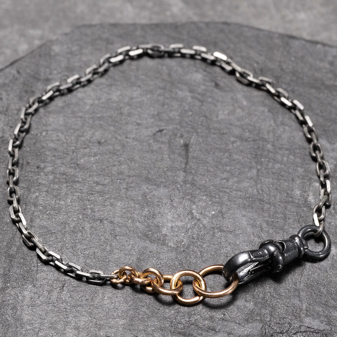 bracelet en chaine intemporel pour femme en or rose et argent noir
