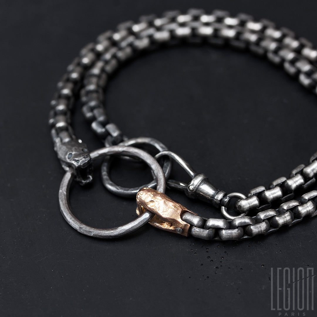 bracelet double tours en argent noir et or rouge, chaine venitienne et deux têtes de serpents.