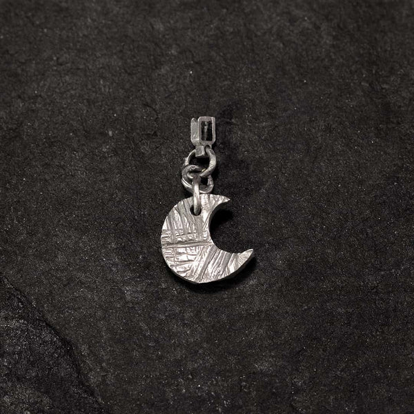 creole earring with textured silver moon charm