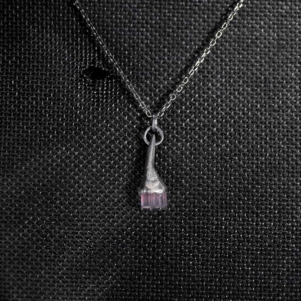 Black silver pendant with rough grey pink tourmaline