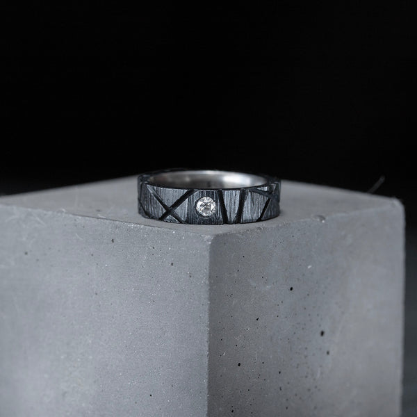 textured black silver ring with grey diamond