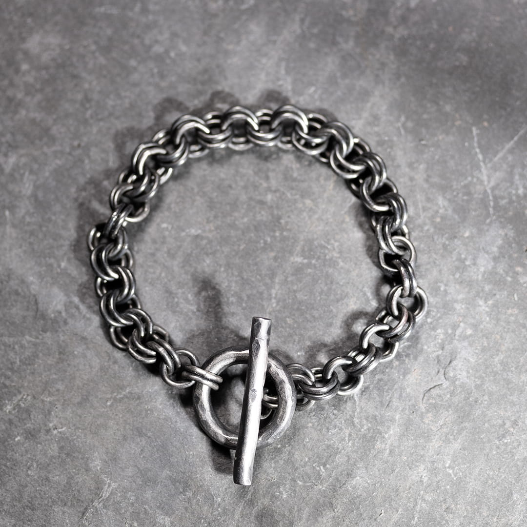 bracelet original en argent avec un double chaine et un fermoir anneau barrette