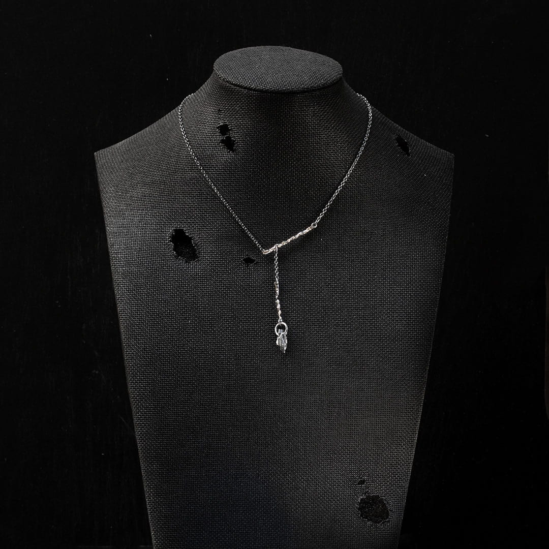 collier mobile en argent et or blanc